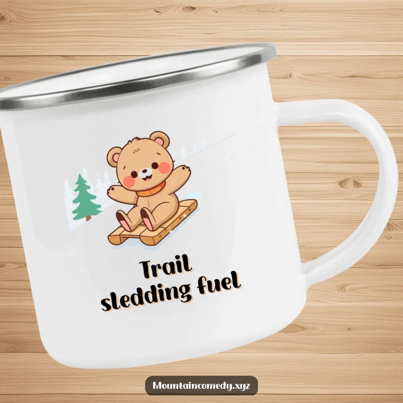 Funny bear cub character sledding down a snowy mountain, bringing outdoor adventure and humor to this durable camping mug.