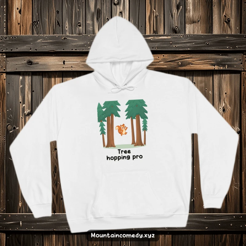 Funny squirrel character leaping between pine trees, depicted on a warm and cozy hoodie for playful spirits.