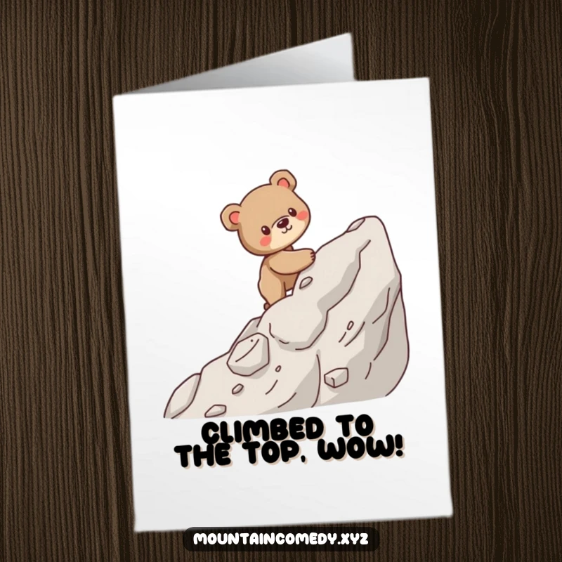 Free printable congratulations card showing a brave bear cub cub carefully scaling a rugged mountain face, celebrating a successful climb.